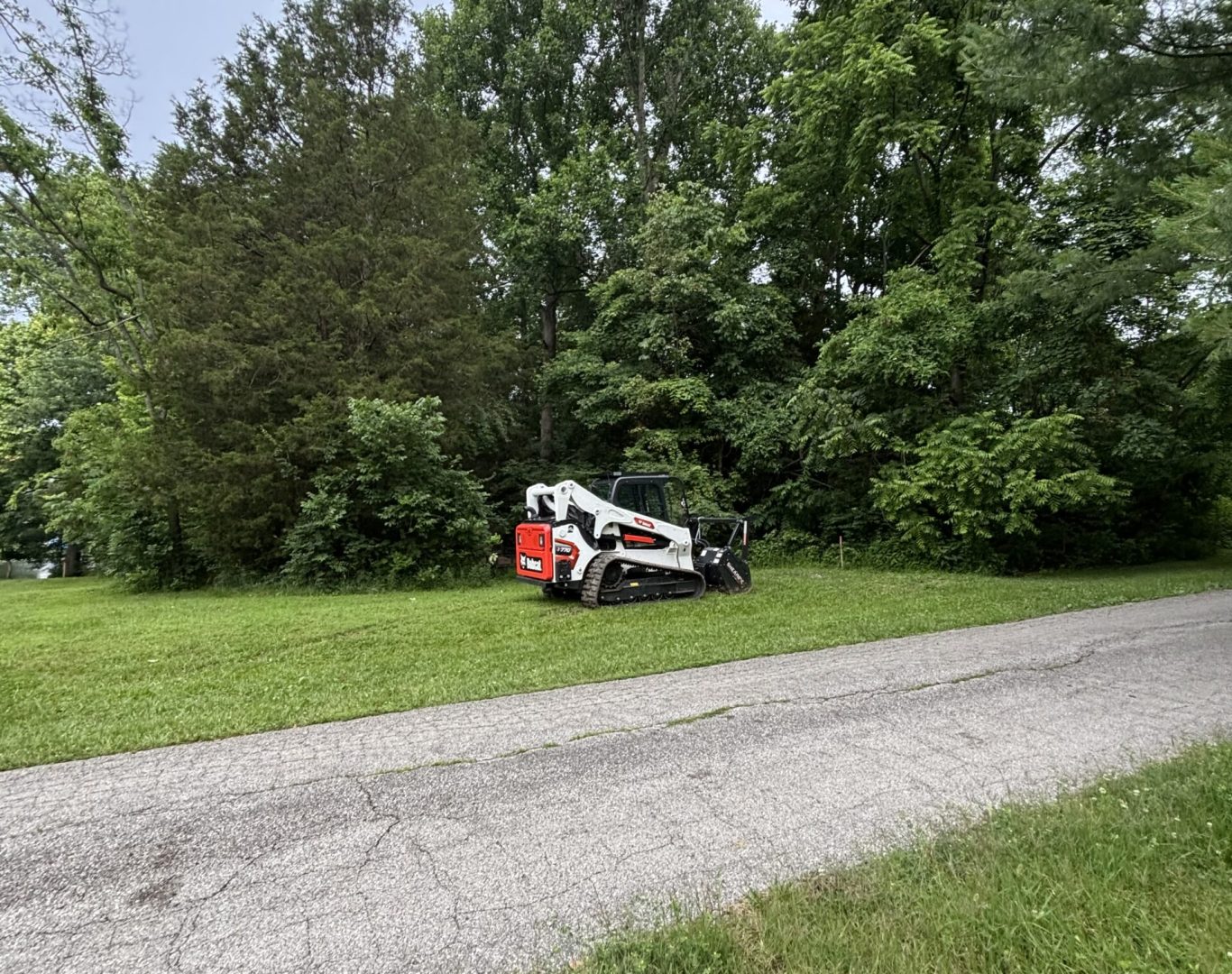 Land clearing machinery in Madison County KY preparing site